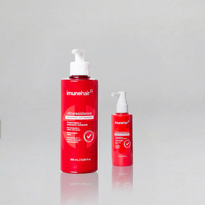 Dois produtos vermelhos da linha antiqueda UltraResistance da Imunehair. Shampoo Antiqueda UltraResistance de 380ml e Tônico Antiqueda UltraResistance de 80ml.