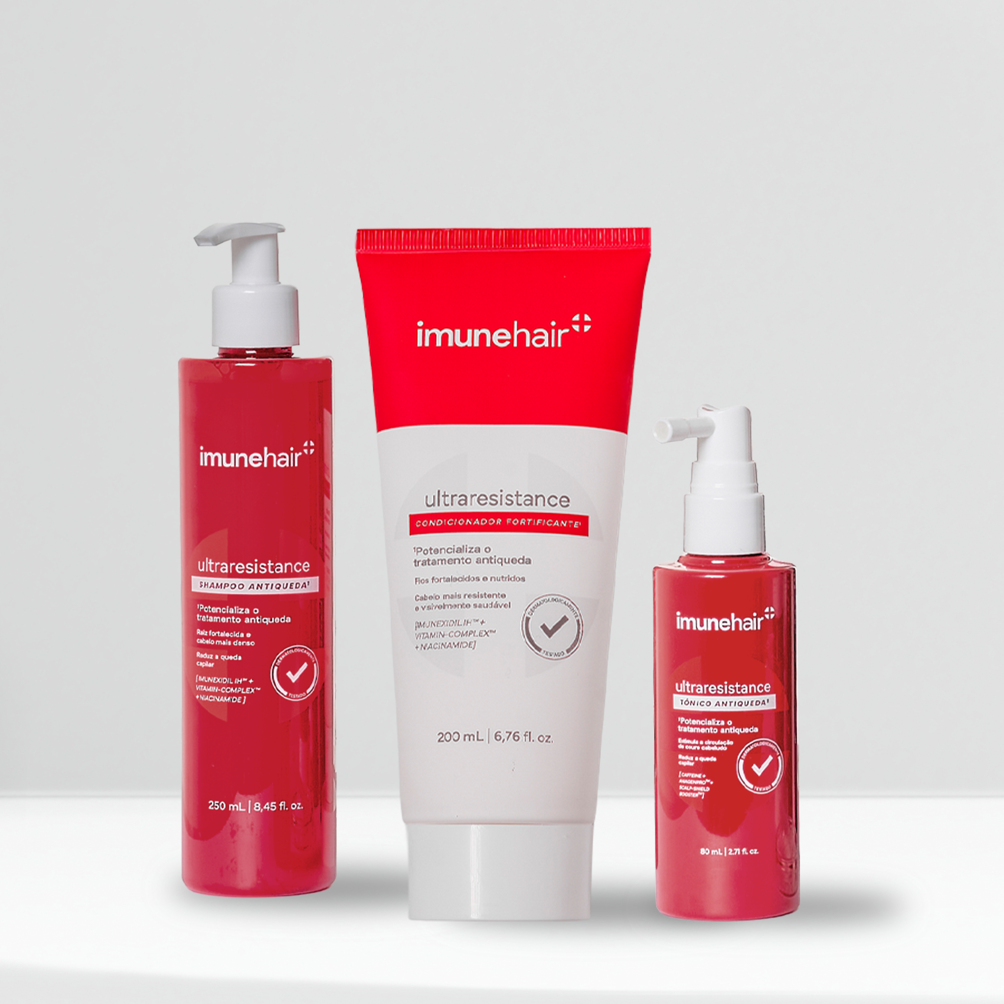 Embalagem vermelha do shampoo, condicionador e tônico, com os nomes UltraResistance Shampoo Antiqueda de 250ml, UltraResistance Condicionador Fortificante de 200ml e UltraResistance Tônico Antiqueda de 80ml.