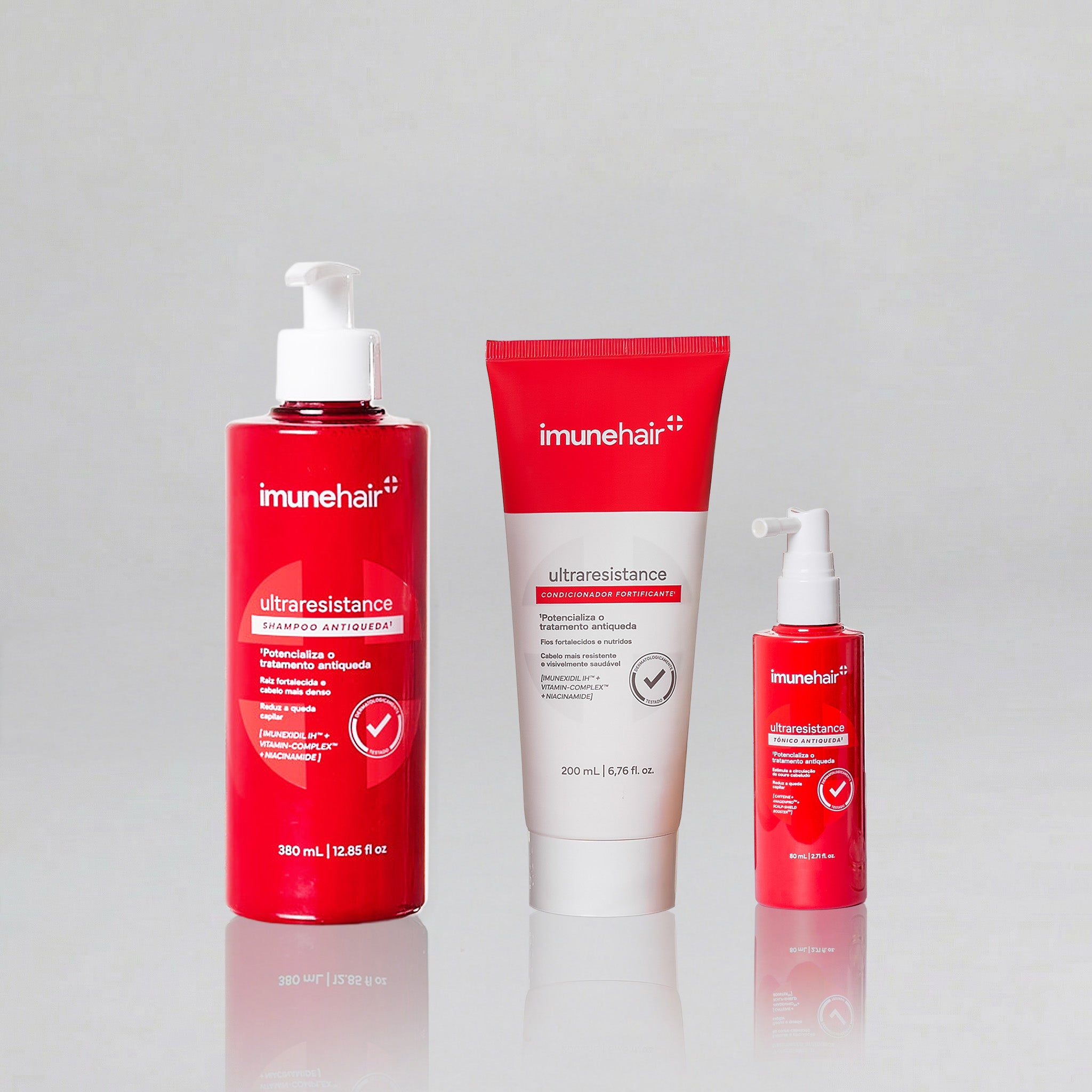 Embalagem vermelha do shampoo, condicionador e tônico, com os nomes UltraResistance Shampoo Antiqueda de 380ml, UltraResistance Condicionador Fortificante de 200ml e UltraResistance Tônico Antiqueda de 80ml.