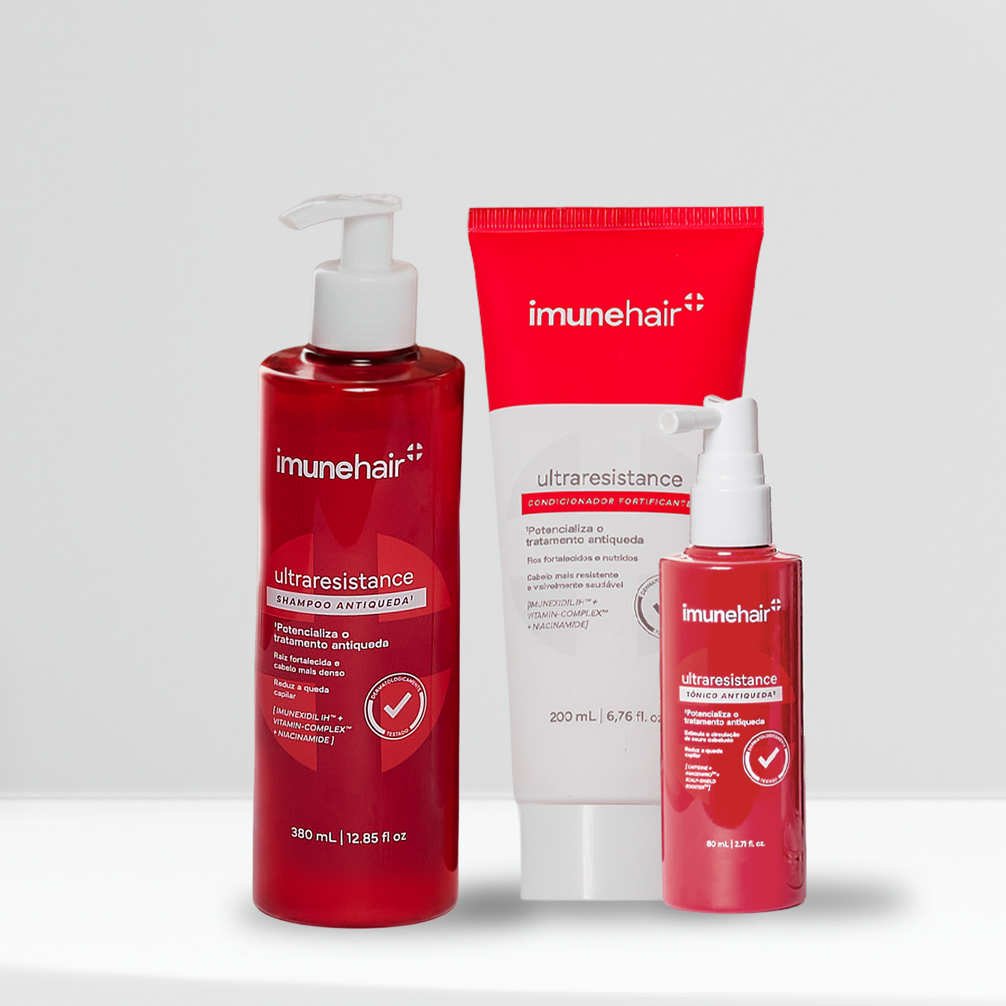 Embalagem vermelha do shampoo, condicionador e tônico, com os nomes UltraResistance Shampoo Antiqueda de 380ml, UltraResistance Condicionador Fortificante de 200ml e UltraResistance Tônico Antiqueda de 80ml.