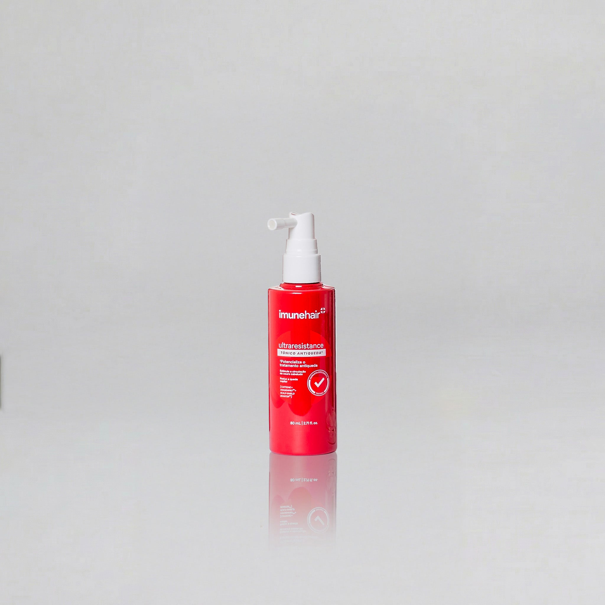 Embalagem vermelha do tônico antiqueda com spray na ponta, escrito Ultraresistance Tônico Antiqueda de 80ml.